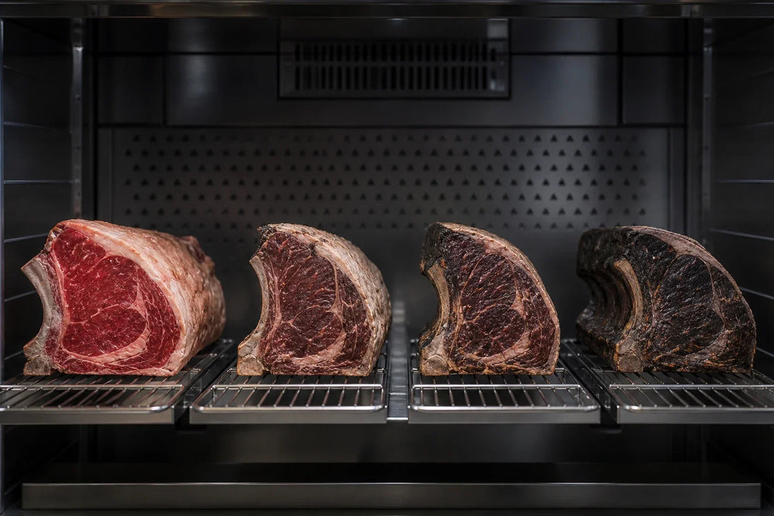Dry-aged beef timeline shown with rib sections at several stages inside an aging room